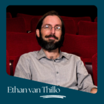 Portrait of Ethan van Thillo, a man with glasses and a beard, seated in a theater with red velvet seating, wearing a gray button-up shirt, with his name stylized in white text over a teal background.